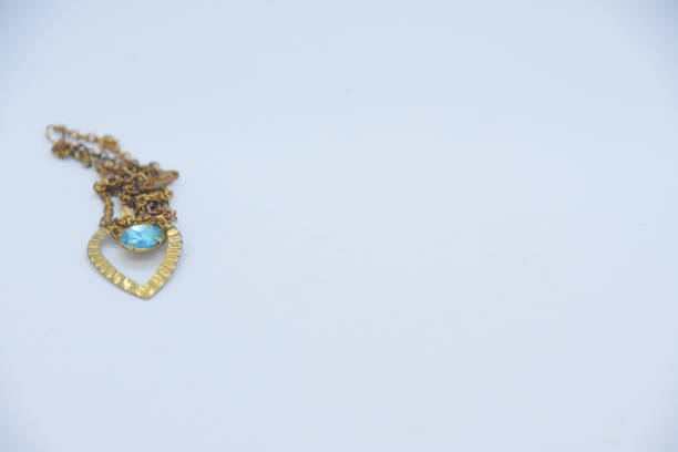 istock Necklace with a heart on a white background 1031497352