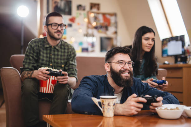 istock Friends playing games at home after work 1031497386
