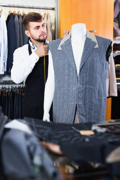 istock Handsome male tailor  working  in atelier 1031504652