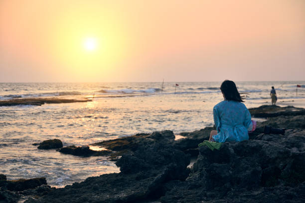 istock woman on the beach 1031507158