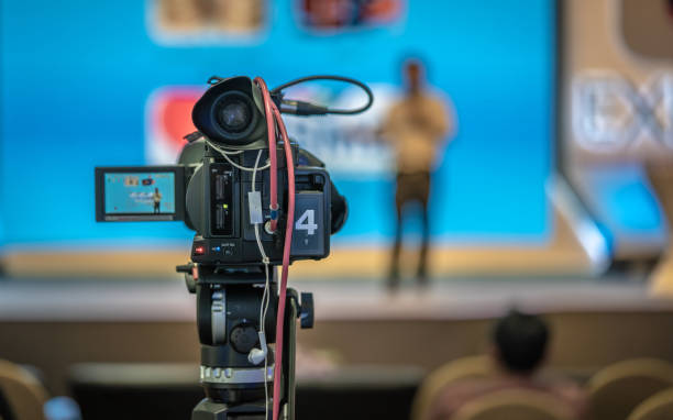 Working Photo News Reporter With Video Camera Recorder Broadcasting camera covers pictures stock pictures, royalty-free photos & images