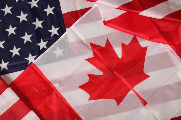 istock american and canadian flag 1031508582