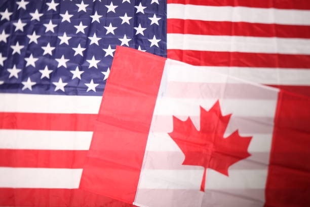 istock american and canadian flag 1031508656