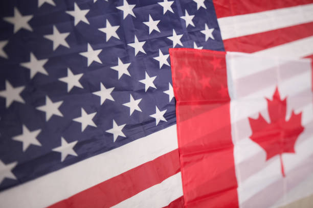 istock american and canadian flag 1031508674