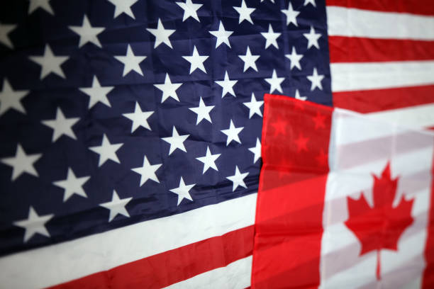 istock american and canadian flag 1031510706