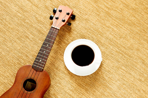 istock Top view with ukulele on the floor There are cup of coffee is placed 1031511744