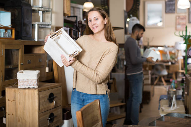 istock Smiling gir in search of things for home interior 1031512136