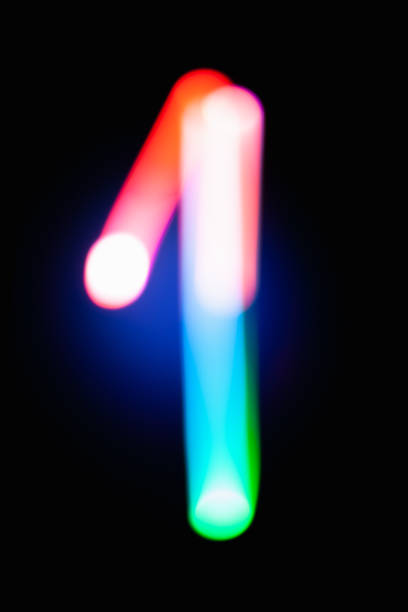 istock Digit 1. One. Glowing numbers on dark background. Abstract light painting at night. Creative artistic colorful bokeh. New Year. Use it for build you own design for book cover, poster or post card. 1031516144