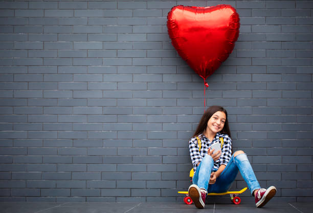 girl with heart shape air balloon - valentines day heart shape love child imagens e fotografias de stock