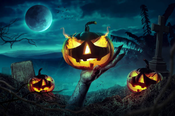 istock Zombie hands rising in dark Halloween night. 1031522388
