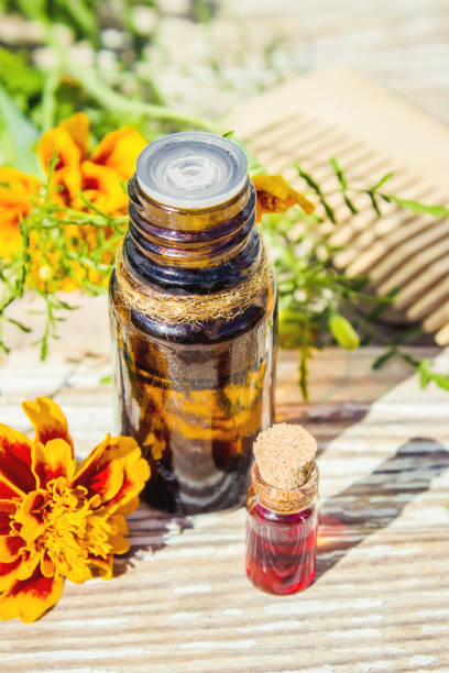 istock nettle tincture in a small bottle and fresh leaves on white wood, medicinal herb for overweight, diabetics and kidney weakness, selected focus, narrow depth of field 1031522496