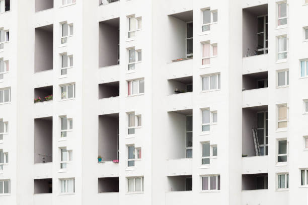 istock Minimalist architecture. Residential tower with bright light and white color. 1031523052