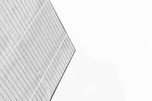 Photo of Minimalist architecture pointing into the sky with geommetrical lines in black and white
