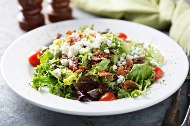 istock Green salad with blue cheese and bacon 1031526370