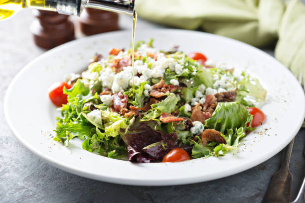 istock Green salad with blue cheese and bacon 1031526392