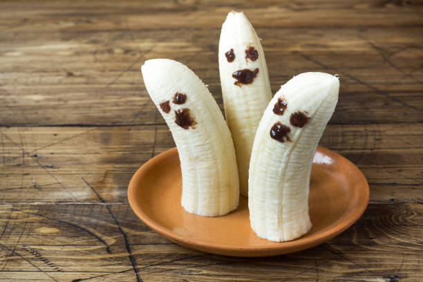 istock Painted funny faces on bananas for Halloween 1031529216