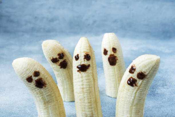 istock Painted funny faces on bananas for Halloween 1031534098