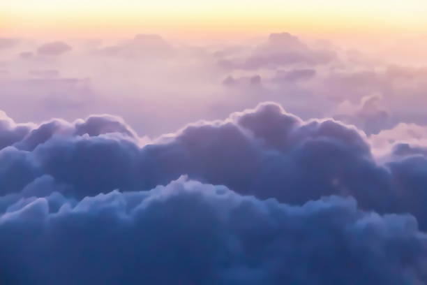 istock Beautiful golden orange sunset time or light sunrise. Flight over clouds. 1031535314