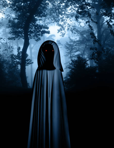 istock Spooky monster in hooded cloak in misty forest 1031535480