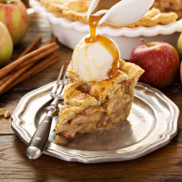 istock Homemade apple pie slice with vanilla ice cream 1031535650