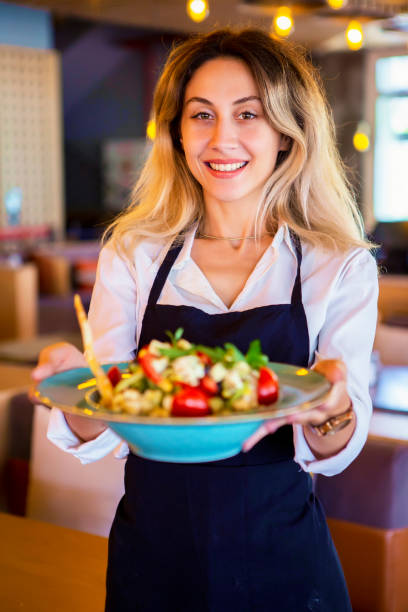 istock Beautiful waitress working at a restaurant 1031544732
