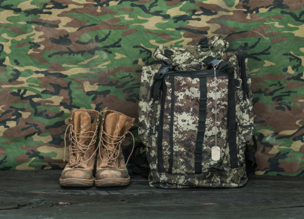 istock Soldier equipment,weapons, backpack and boots 1031545388