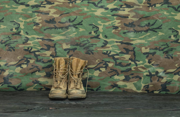 istock old  military boots on a wooden table 1031546634