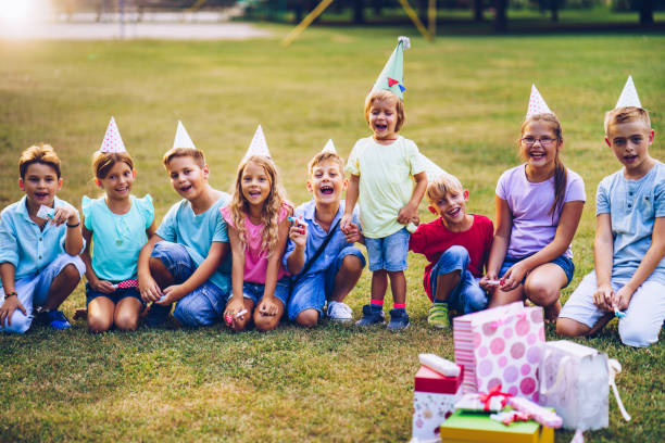 istock Children singing birthday song at public park 1031548556