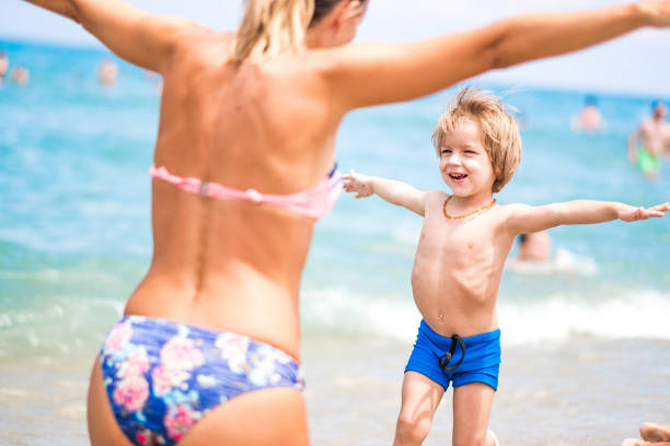 istock Mom and son at the beach 1031552116