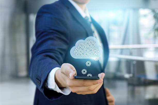 istock Businessman downloads her settings from the cloud data. 1031563496