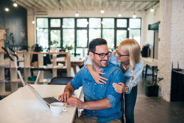 istock Happy young couple hugging while planning start up business. 1031563620