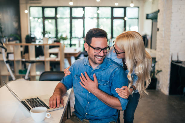 istock Successful smiling business couple hugging. 1031563646