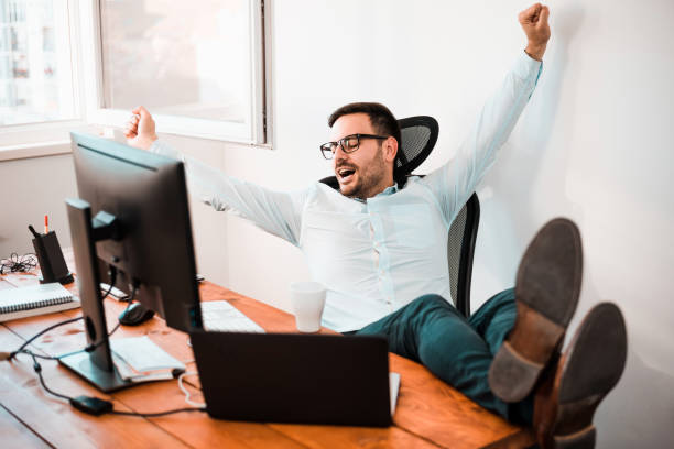 istock Tired buissnisman streching in his office. 1031563764