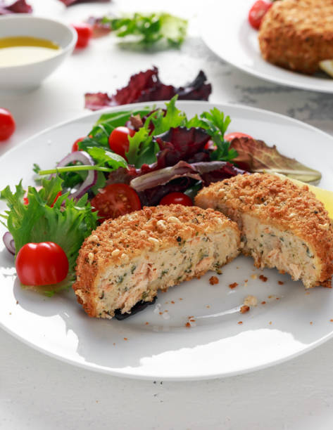 istock Home made Fish Cake salmon, spinach and potato. served on plate with vegetables 1031570954