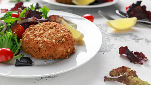 istock Home made Fish Cake salmon, spinach and potato. served on plate with vegetables 1031570960
