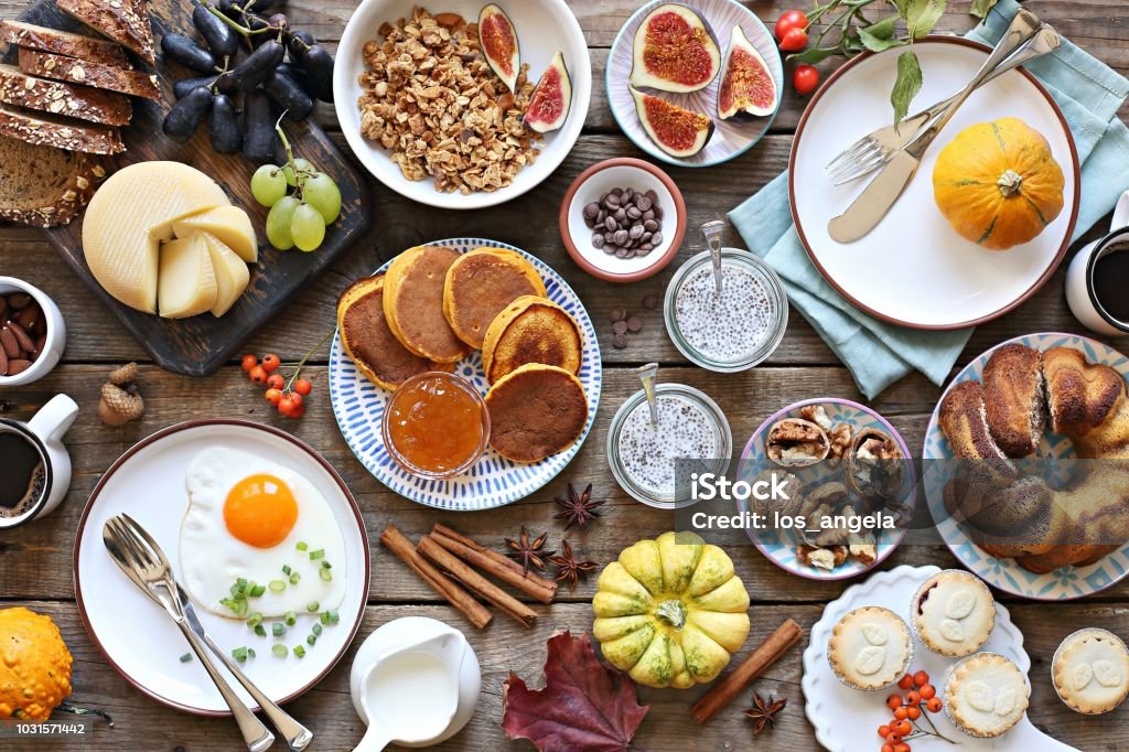 Brunch. Brunch. Thanksgiving family breakfast or brunch set served on rustic wooden table. Overhead view, copy space Brunch Stock Photo