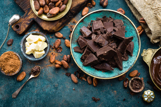 istock Chocolate. Dark bitter chocolate chunks, cacao butter, cocoa powder and cocoa beans. Chocolate background 1031584196