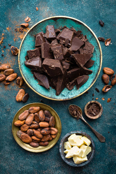 istock Chocolate. Dark bitter chocolate chunks, cacao butter, cocoa powder and cocoa beans. Chocolate background 1031584242