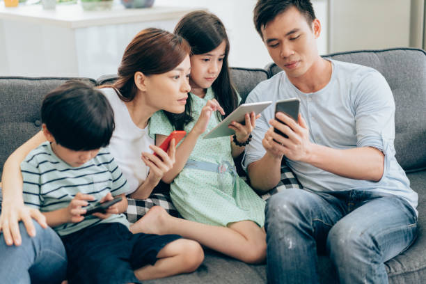 istock Young family have fun with digital devices 1031593546