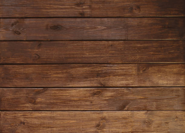 istock brown wooden plank desk table background texture top view 1031593716