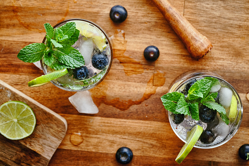 Blueberry Mojito with white rum, lime, mint and crushed ice