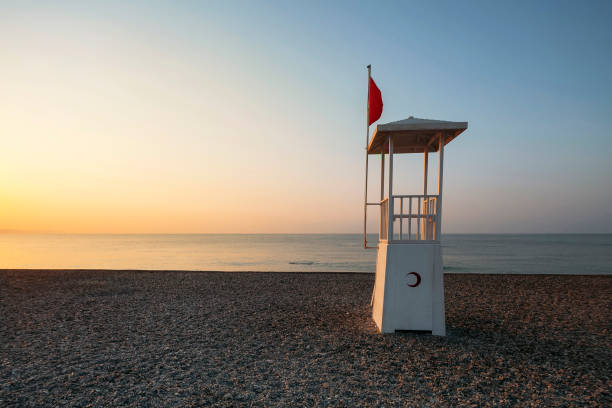 istock Beach Sunrise with Lifeguard Chair 1031603166