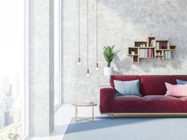 istock Concrete wall living room with red sofa 1031612750