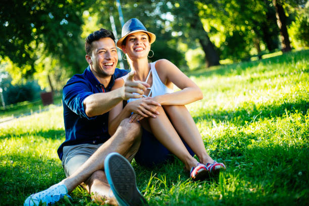 istock Smiling couple in a park hugging affectionately 1031616226