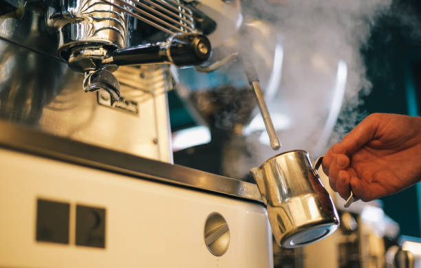 istock Barista making a cup of coffee in machine 1031617438