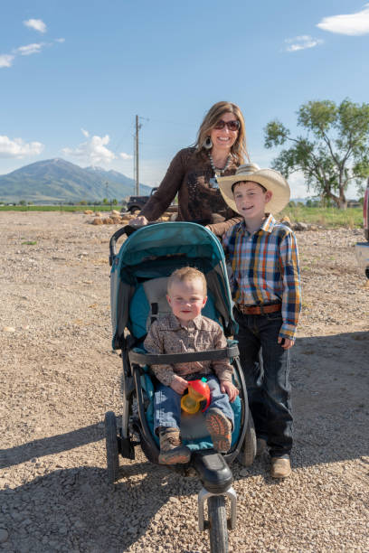 istock Mother and two sons pause on way to rodeo event 1031619902