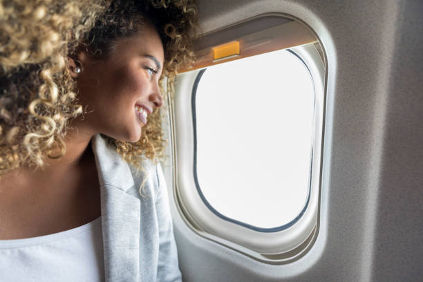 istock Woman looks out window during flight 1031622936