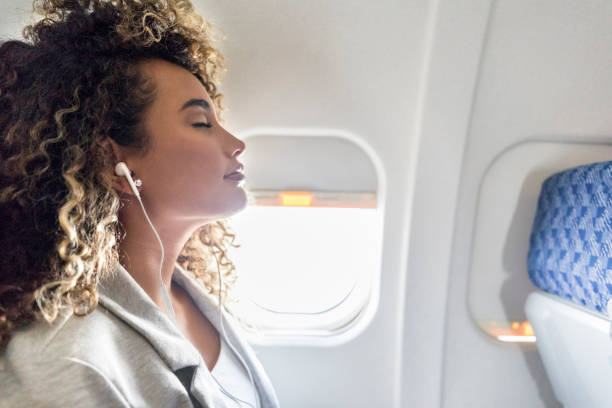 istock Young woman relaxing during flight 1031623230
