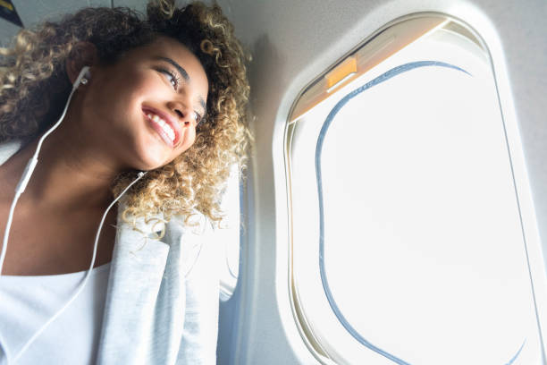 istock Smiling woman enjoys flight 1031623232