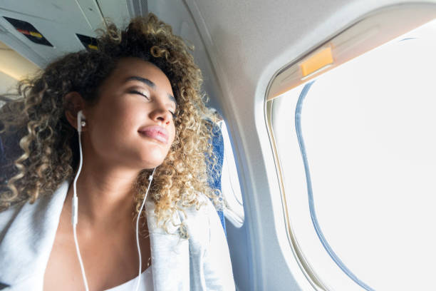 istock Woman relaxes while on airplane 1031623234
